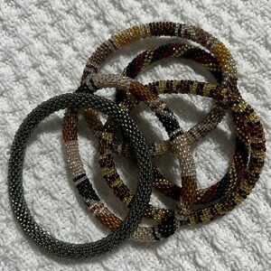 5 Sashka Co handcrafted beaded bracelets. Dark metallic colors. Approx 8”.